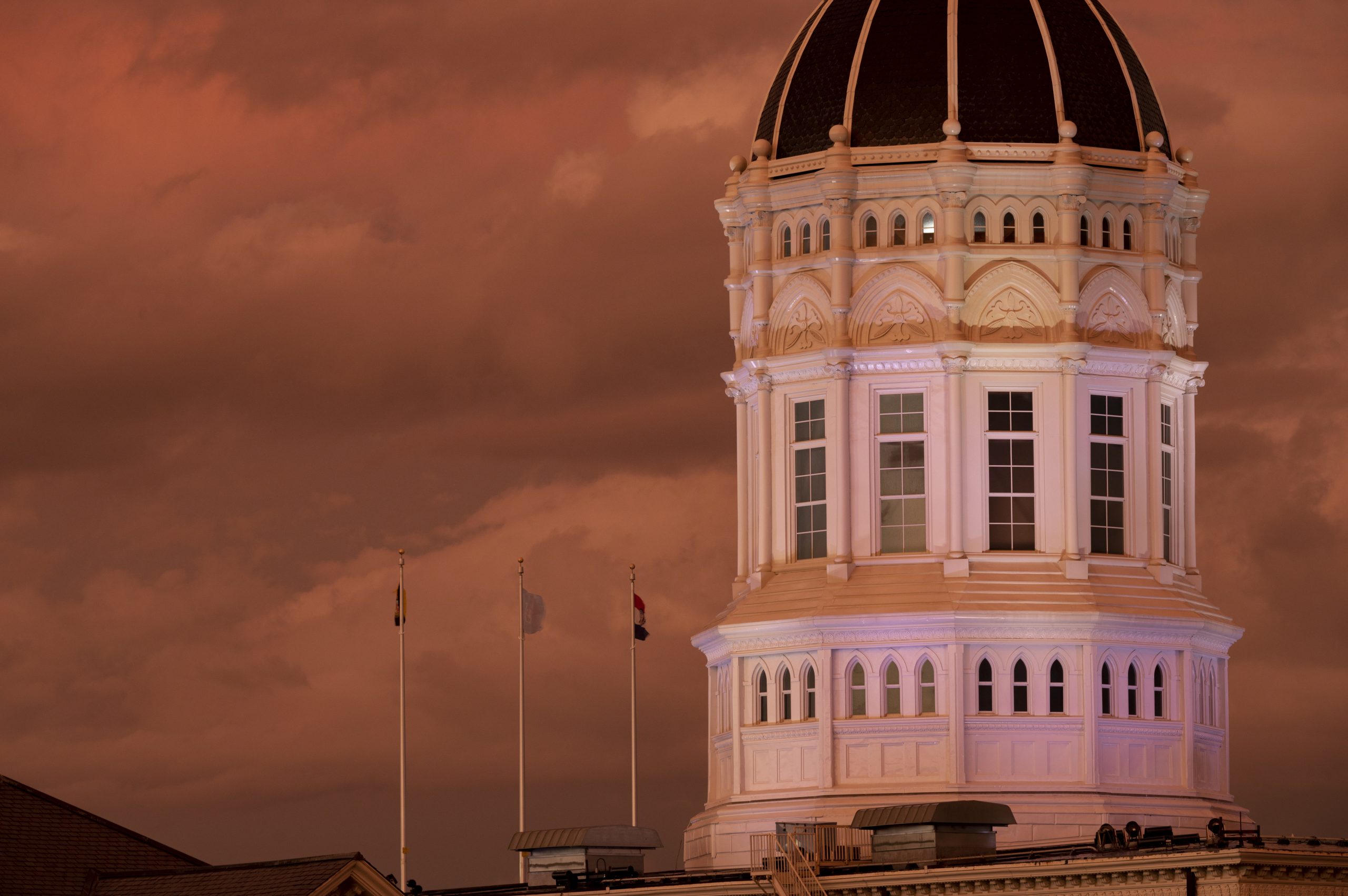 Rain storm passes Jesse Hall during sunset
